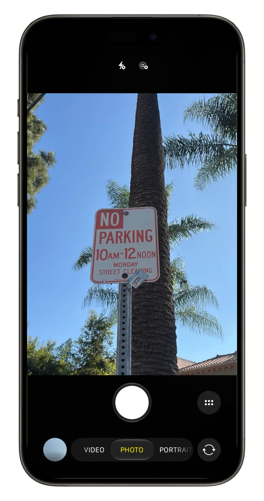 Phone camera view of a parking sign